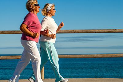 Two elderly jogging/exercising